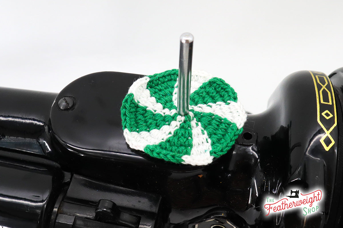 Spearmint Candy spool pin doily shown on the machine