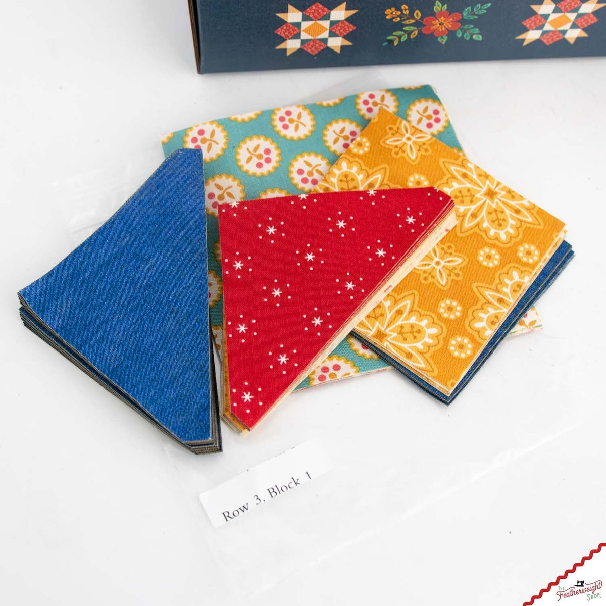 Stacks of laser-cut triangles in blue, red, teal and gold
