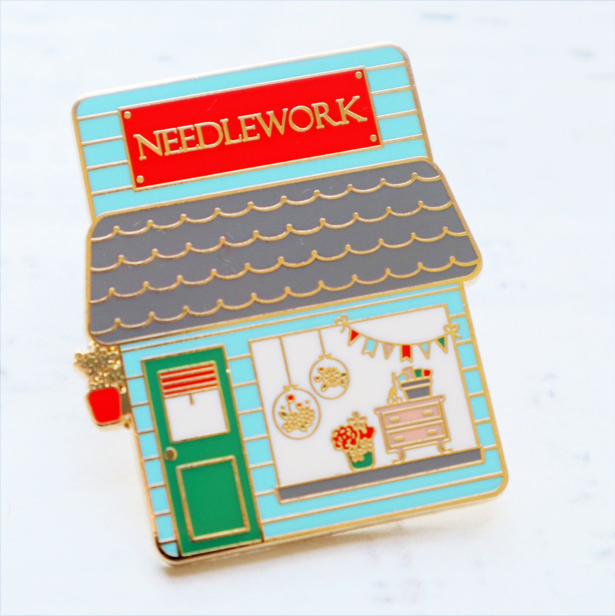 Needlework shop enamel pin