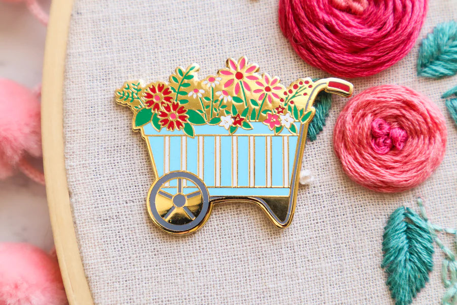 spring flowers wheelbarrow needle minder