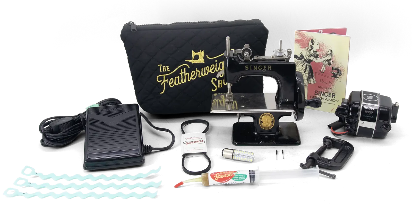 The Birthday Giveaway prizes: a Singer Sewhandy, Tru-Wound motor, Electronic Foot Controller, pouch, Superbelt, LED bulb, grease and cord wraps
