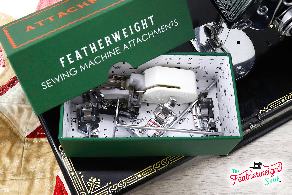 Quilter's Attachment Set open on the Featherweight bed