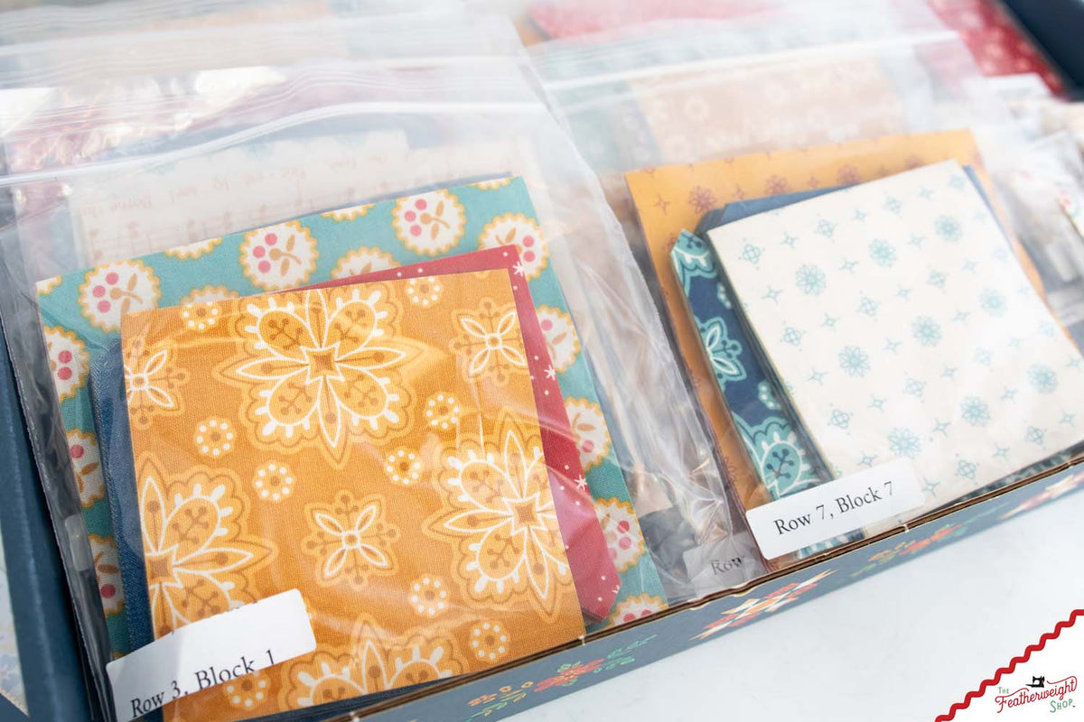 Close-up of labeled bags of laser-cut pieces