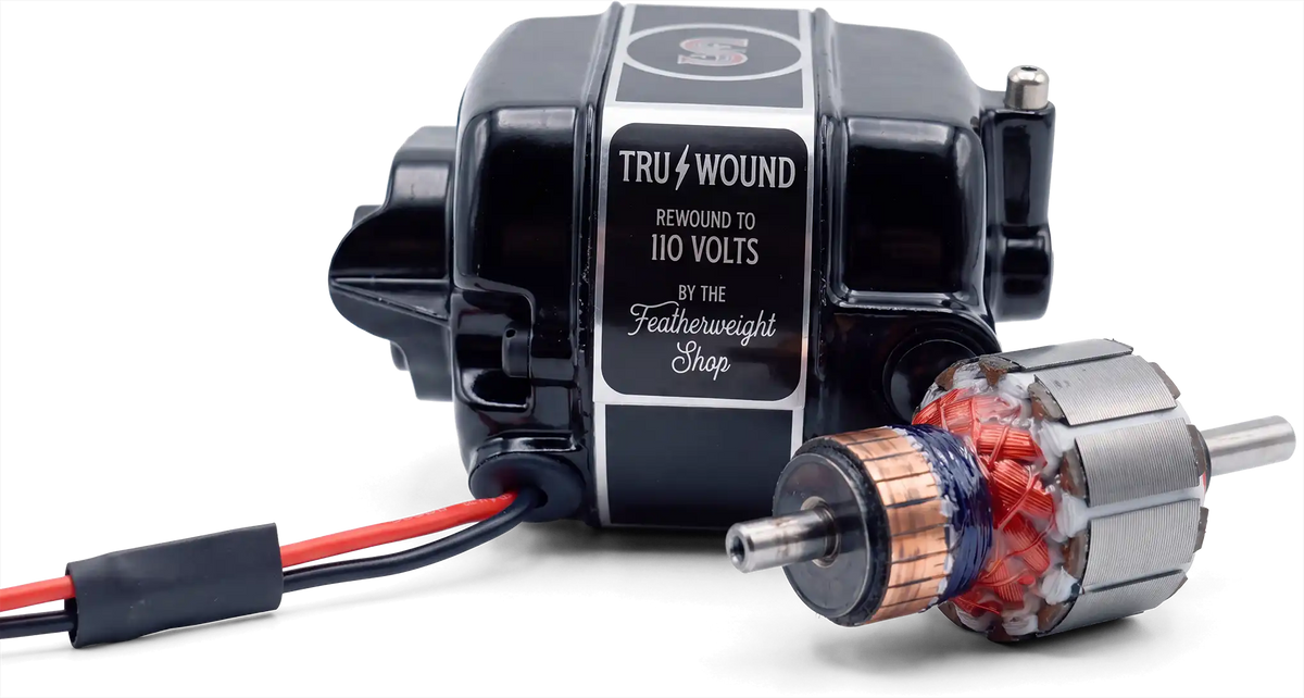 A Tru-Wound motor with its Tru-Wound label, beside a freshly rewound armature