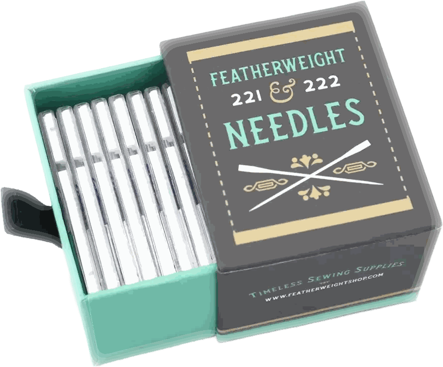 The Featherweight needle box, drawer open, with the Schmetz Chrome Microtex packs inside